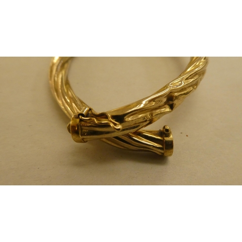 294 - A 9ct gold hollow ropetwist effect bangle