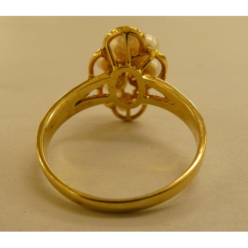 297 - Jewellery: to include an 18ct gold ring, set with seed pearls and two diamond chips 