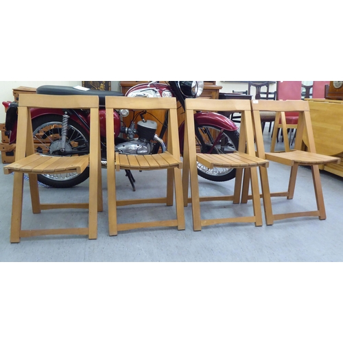 30 - A set of four modern folding beech framed chairs