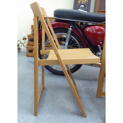 30 - A set of four modern folding beech framed chairs