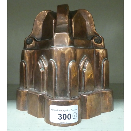 300 - A late Victorian copper jelly mould, fashioned as a church  6.25