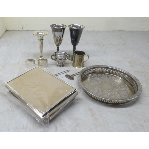 31 - Silver and silver plate: to include decanter labels; photograph frames; and a Christening tankard