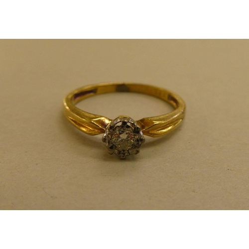 313 - An 18ct gold claw set diamond solitaire ring