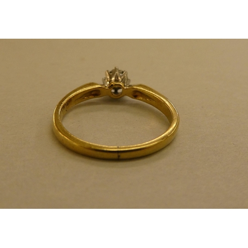 313 - An 18ct gold claw set diamond solitaire ring