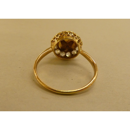 315 - A yellow metal pearl and diamond set cluster ring