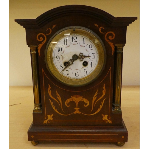 36 - Two dissimilar Edwardian mahogany cased mantle clocks, one faced by an Arabic dial  11.75