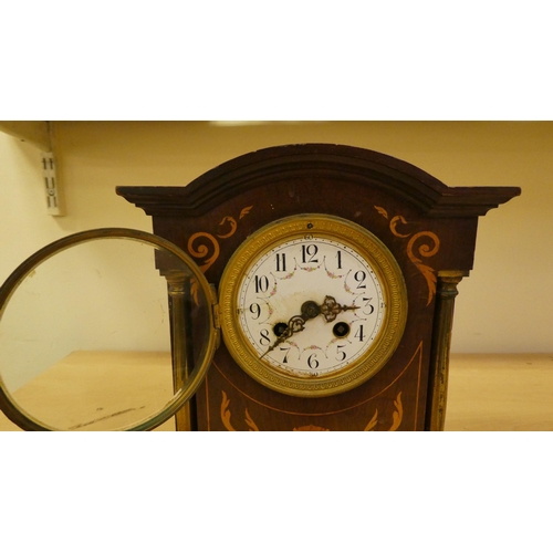 36 - Two dissimilar Edwardian mahogany cased mantle clocks, one faced by an Arabic dial  11.75