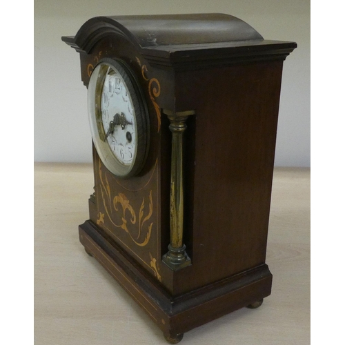 36 - Two dissimilar Edwardian mahogany cased mantle clocks, one faced by an Arabic dial  11.75