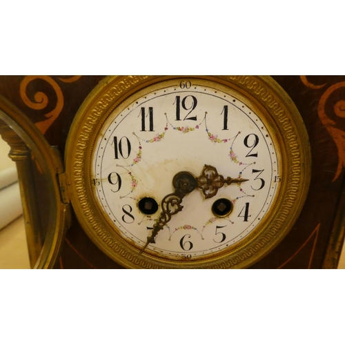 36 - Two dissimilar Edwardian mahogany cased mantle clocks, one faced by an Arabic dial  11.75