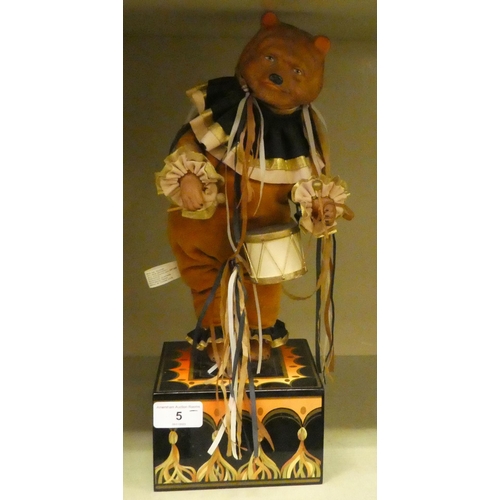 5 - An Enesco Drummer bear, designed by Faith Wick, on a music box plinth  no.358  16