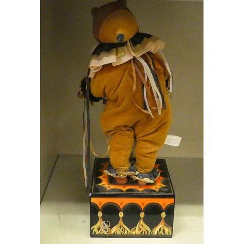 5 - An Enesco Drummer bear, designed by Faith Wick, on a music box plinth  no.358  16