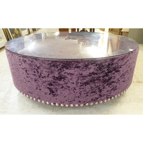 53 - A modern stud upholstered crushed purple velvet coffee table, on a plinth  17