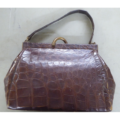 54 - Six dissimilar ladies handbags: to include a simulated snakeskin hide example 