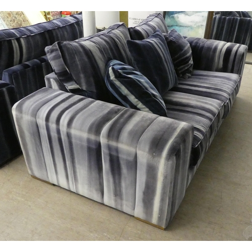 58 - A modern box design settee with a low back, upholstered in striped blue/grey fabric with a cushioned... 