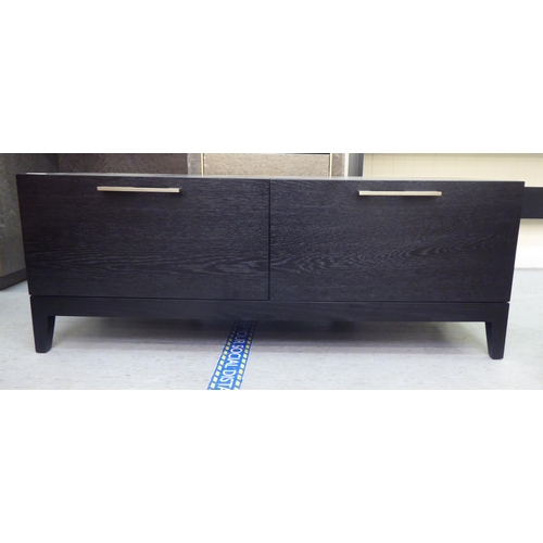 60 - A modern black ash finished, two drawer hi-fi/television stand with brushed steel bar handles  16