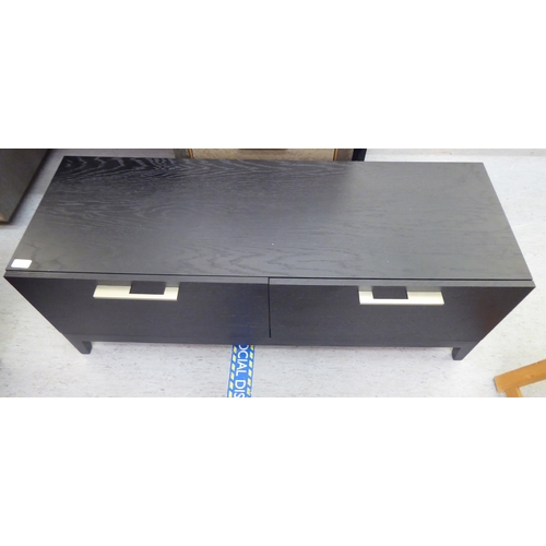 60 - A modern black ash finished, two drawer hi-fi/television stand with brushed steel bar handles  16