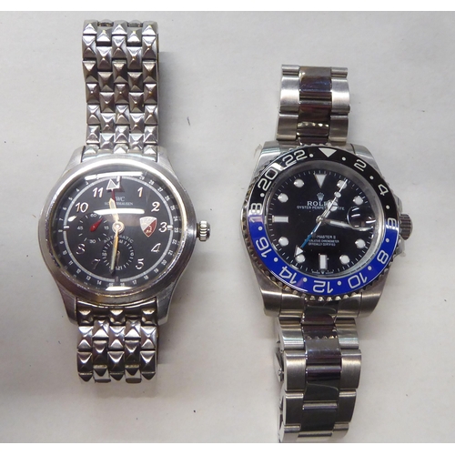 65 - Two unbranded stainless steel cased bracelet watches