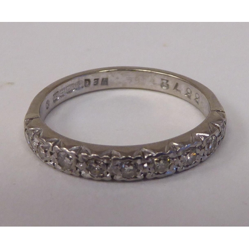 74 - An 18ct white gold and diamond set half-eternity ring