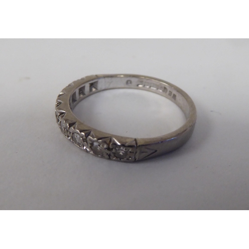 74 - An 18ct white gold and diamond set half-eternity ring