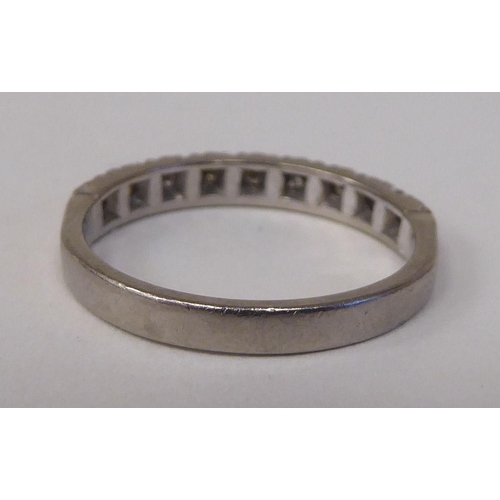 74 - An 18ct white gold and diamond set half-eternity ring