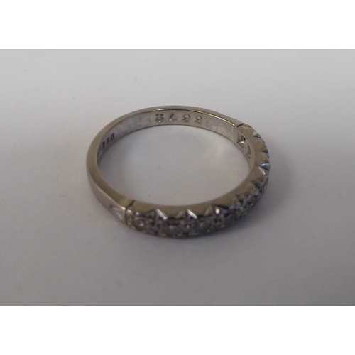 74 - An 18ct white gold and diamond set half-eternity ring