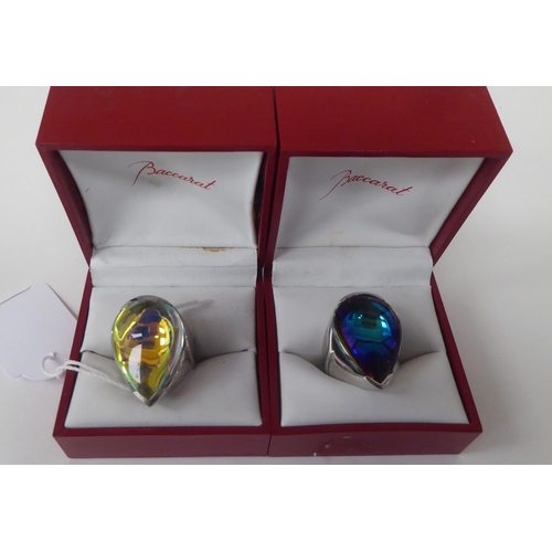 76 - Two silver rings, set with baccarat coloured glass teardrop design stones  both boxed & stamped ... 