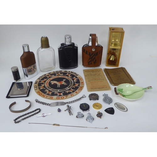 81 - A mixed lot: to include a spirit miniature 'Irish Mist' with shot glass; hip flasks; and a stainless... 