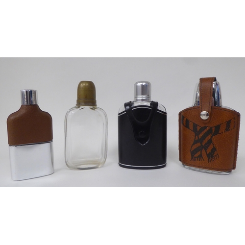 81 - A mixed lot: to include a spirit miniature 'Irish Mist' with shot glass; hip flasks; and a stainless... 