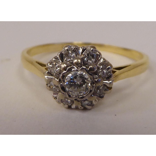 82 - A bi-coloured gold diamond cluster ring