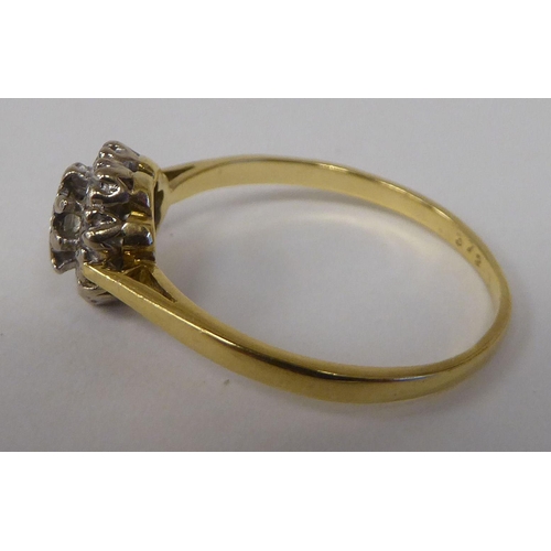 82 - A bi-coloured gold diamond cluster ring