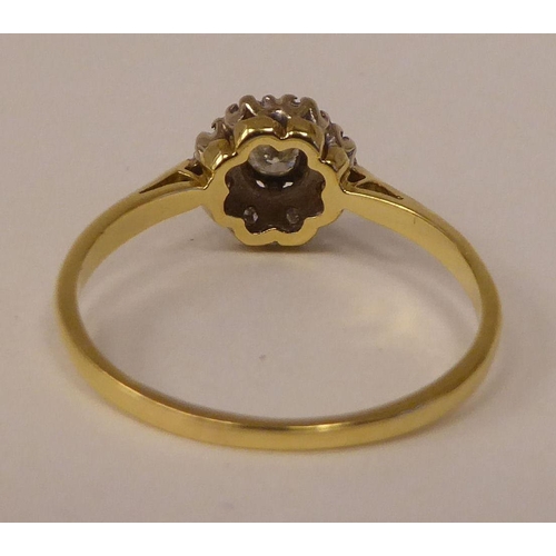 82 - A bi-coloured gold diamond cluster ring