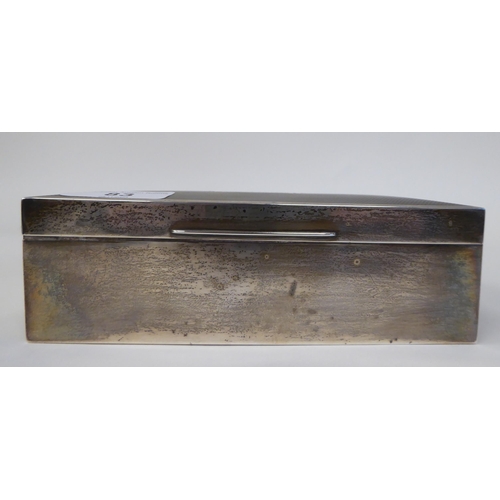 83 - A silver cigarette box with a cedar lined interior  Birmingham 1937  2