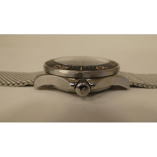 84 - A stainless steel cased and strapped automatic wristwatch 