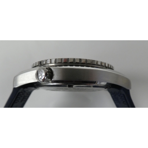 88 - A stainless steel and enamel cased automatic wristwatch, on a rubber strap 