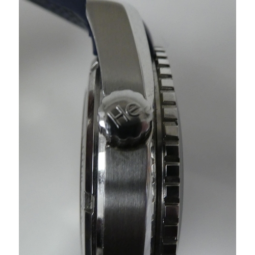 88 - A stainless steel and enamel cased automatic wristwatch, on a rubber strap 