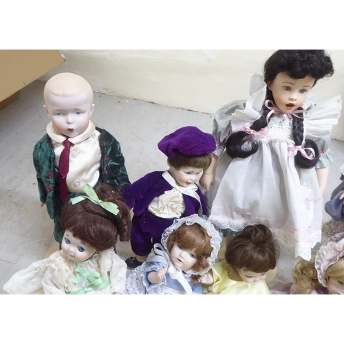 9 - Modern porcelain collectable dolls: to include an example by DNK with painted features  15