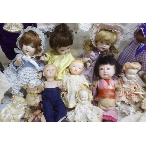 9 - Modern porcelain collectable dolls: to include an example by DNK with painted features  15