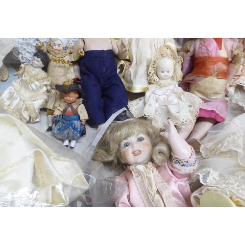 9 - Modern porcelain collectable dolls: to include an example by DNK with painted features  15