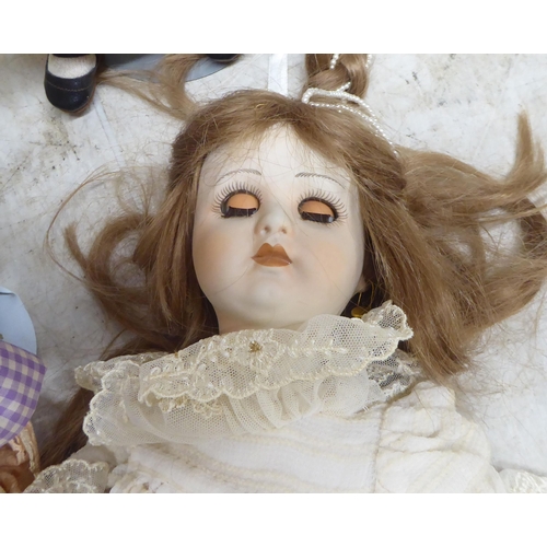 9 - Modern porcelain collectable dolls: to include an example by DNK with painted features  15