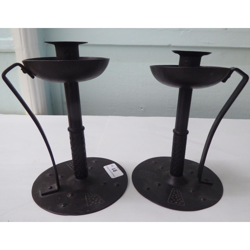 91 - A pair of Arts & Crafts inspired, cast iron candlesticks  stamped Gorers  7