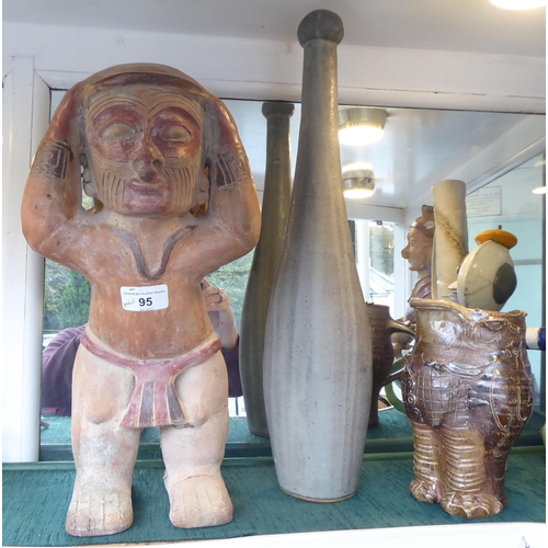 95 - A mixed lot: to include African tourist items; studio pottery and two pottery figures  16