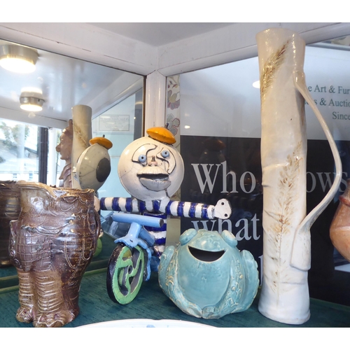 95 - A mixed lot: to include African tourist items; studio pottery and two pottery figures  16