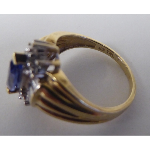 96 - A 10ct gold vintage design ring, set with a blue stone