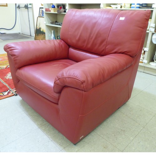 224 - A modern red faux hide upholstered armchair