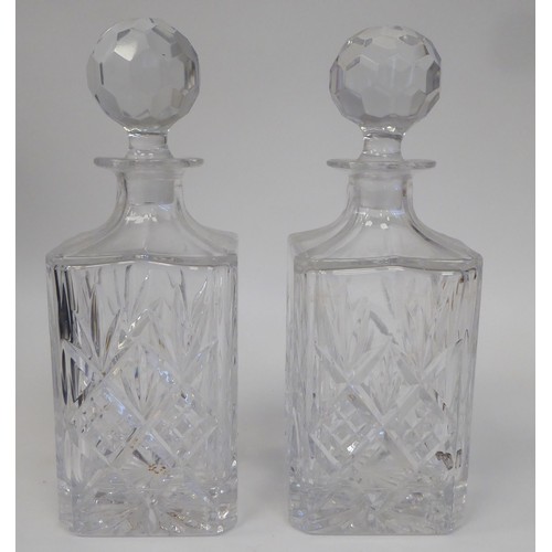 77 - A modern oak tantalus, accompanied by two glass decanters  12.5