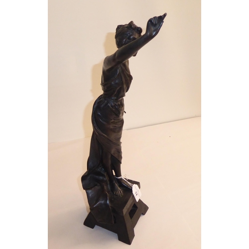 14 - After E Villanis - a cast and patinated standing figure, a classically inspired female artist, on a ... 