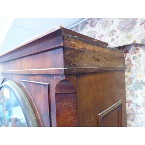 16 - A 19thC mahogany longcase clock case, decorated with a pair of finials  79