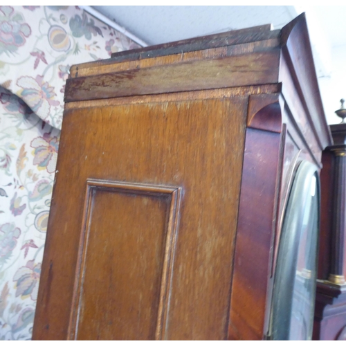 16 - A 19thC mahogany longcase clock case, decorated with a pair of finials  79