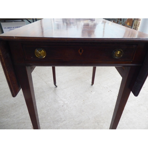 19 - A George III string inlaid mahogany Pembroke table, raised on square, tapered legs and casters ... 