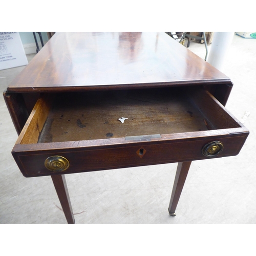 19 - A George III string inlaid mahogany Pembroke table, raised on square, tapered legs and casters ... 